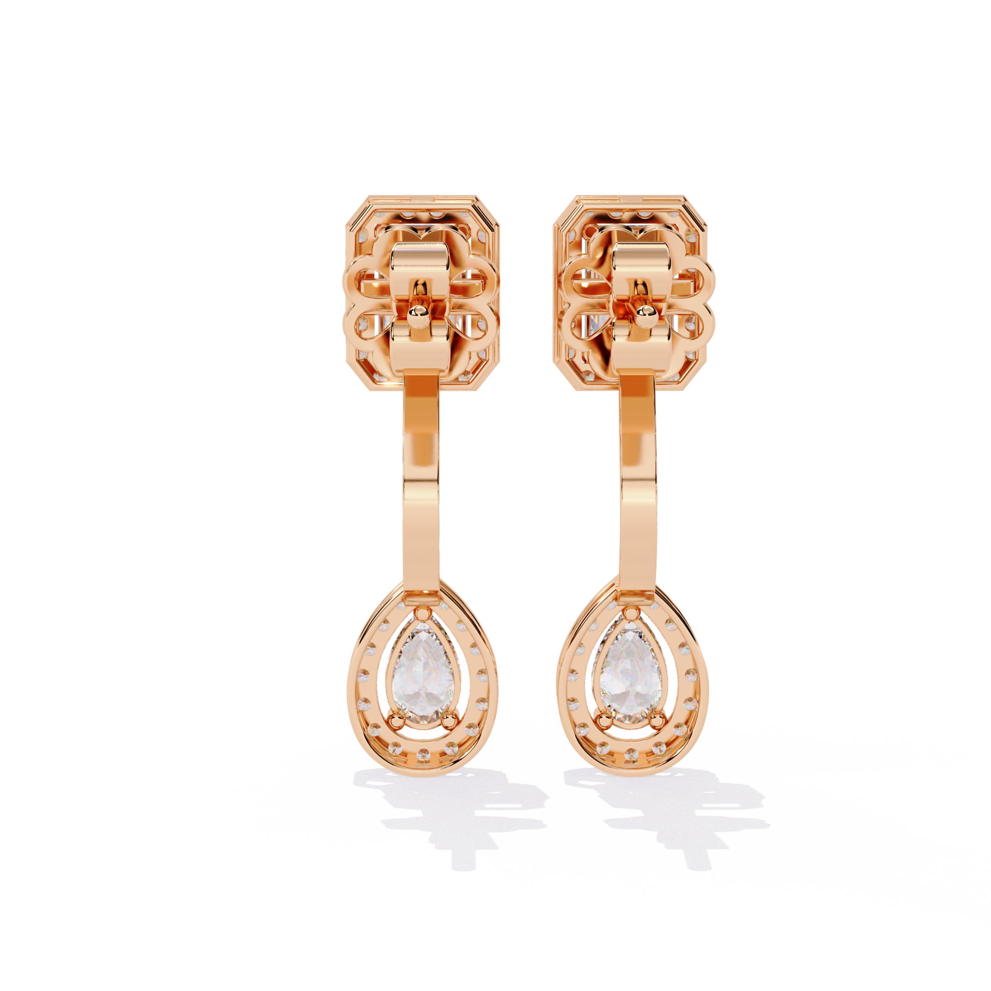 Elegant Diamond Earrings with Emerald and Pear Cut Stones"
