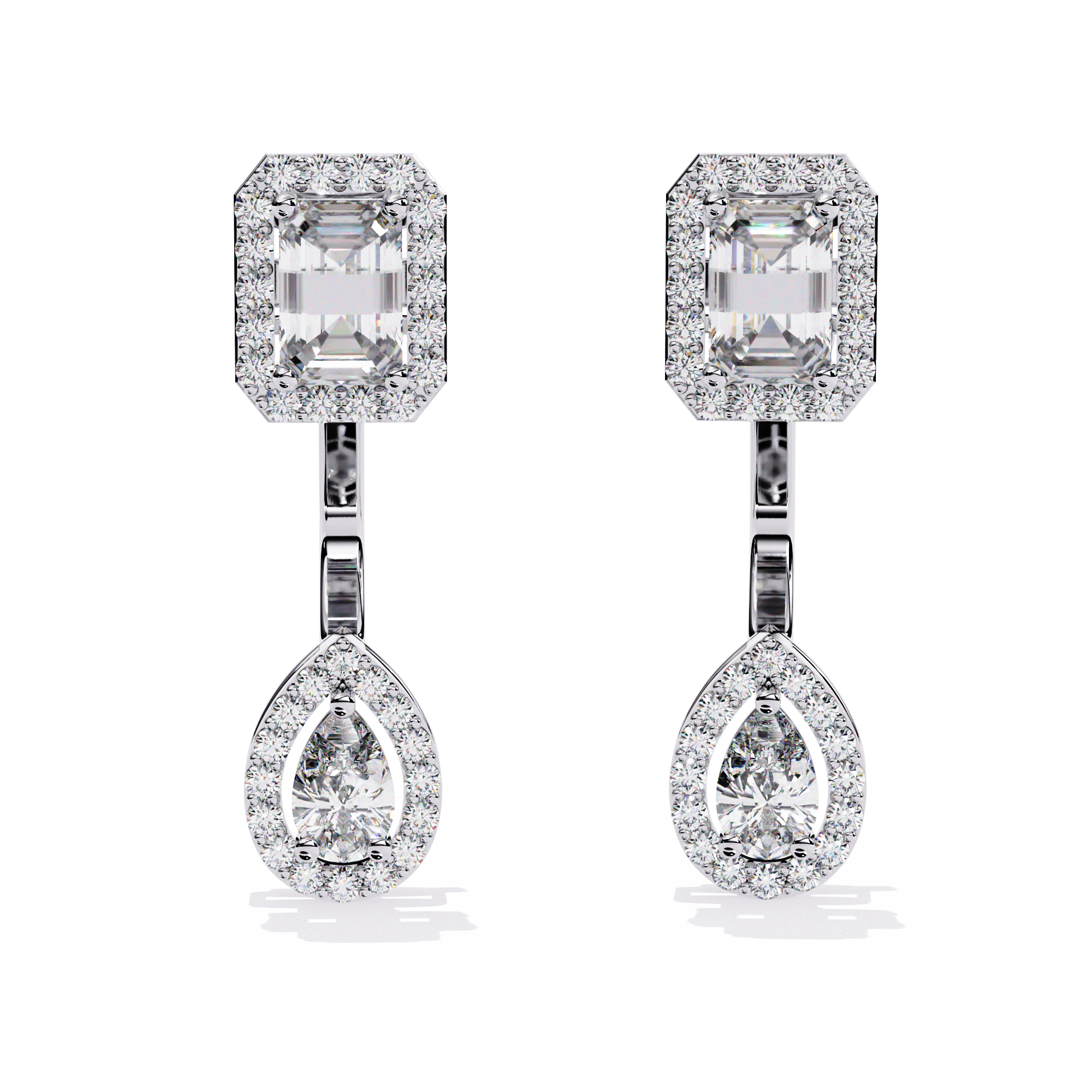 Elegant Diamond Earrings with Emerald and Pear Cut Stones"