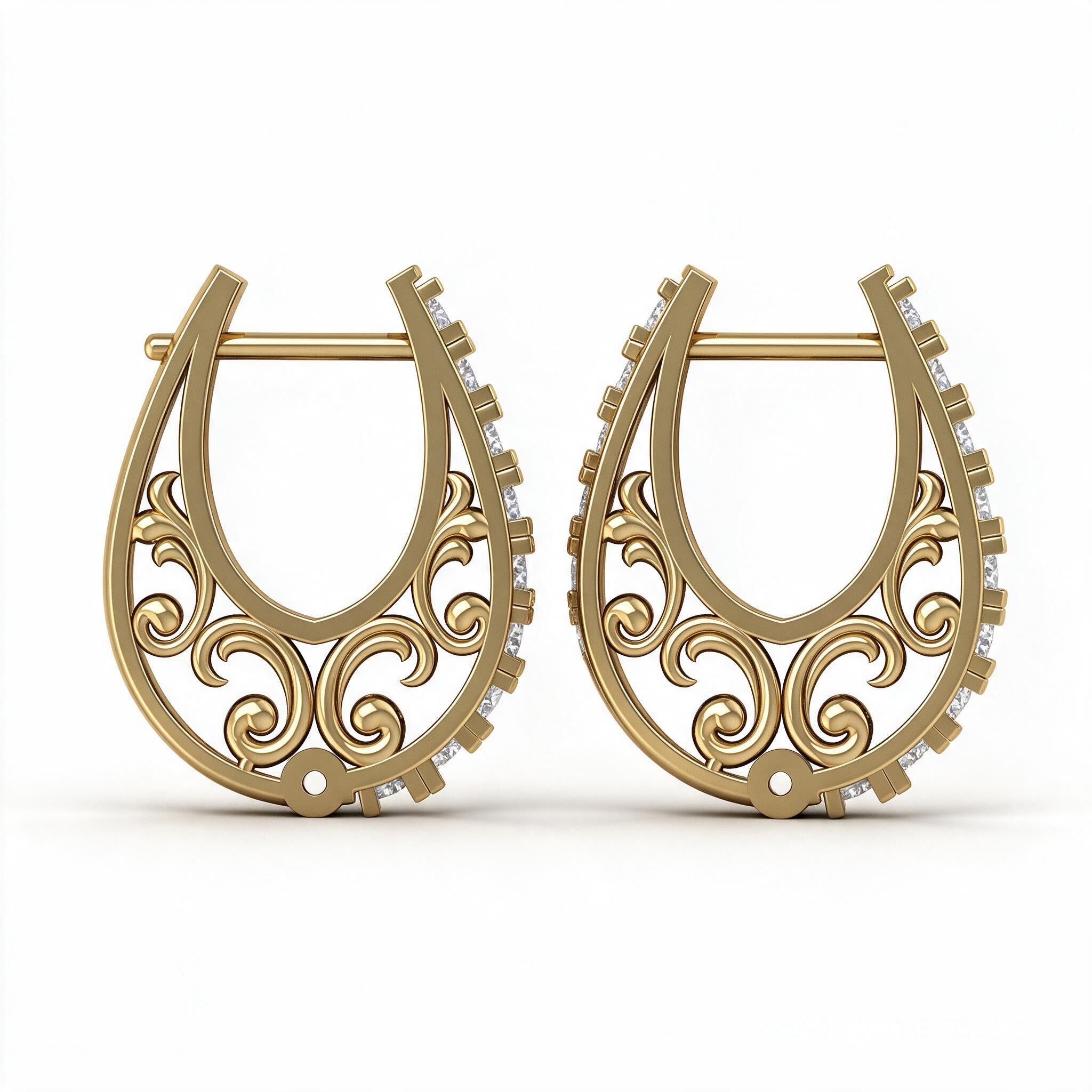 A pair of gold horseshoe-shaped hoop earrings with intricate scrollwork cutouts and small clear stones along the outer edges, shown on a clean white background.
