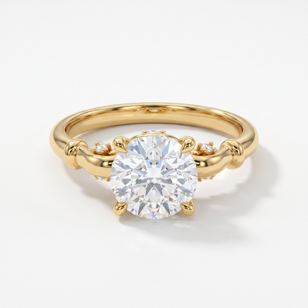 A yellow gold solitaire engagement ring with a round brilliant-cut center stone and small accent diamonds on the band, set against a clean white background.