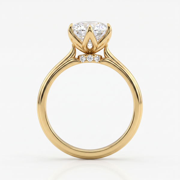 A yellow gold ring with a large round-cut diamond center stone and two small accent diamonds, shown on a clean white background.