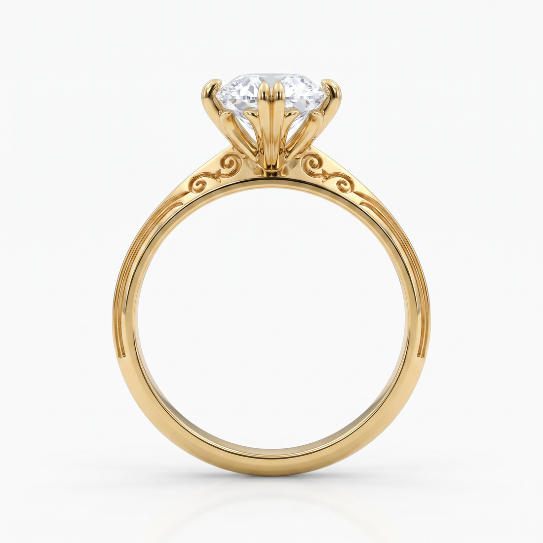 A yellow gold solitaire engagement ring with a round brilliant-cut diamond set in a four-prong crown, shown on a clean white background.