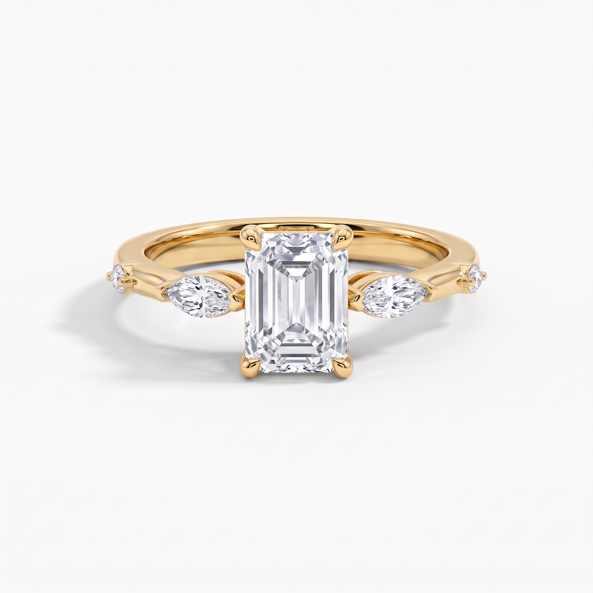The Marquise Accent Three-Stone Emerald Diamond Ring